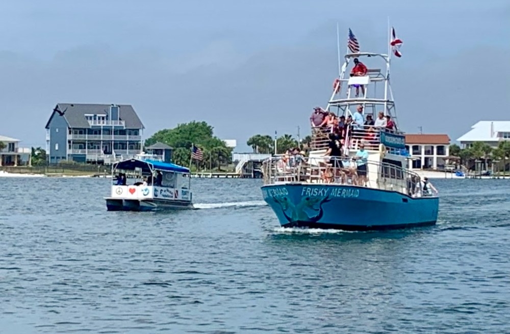 Frisky Mermaid and Frisky1 Dolphin Boats inbound in Little Sabine